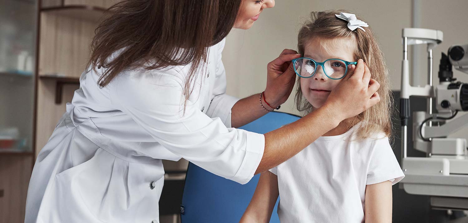Little Girl Getting Fitted for Pair of Glasses