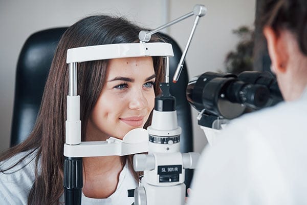 Woman Getting an Eye Exam from Eye Doctor