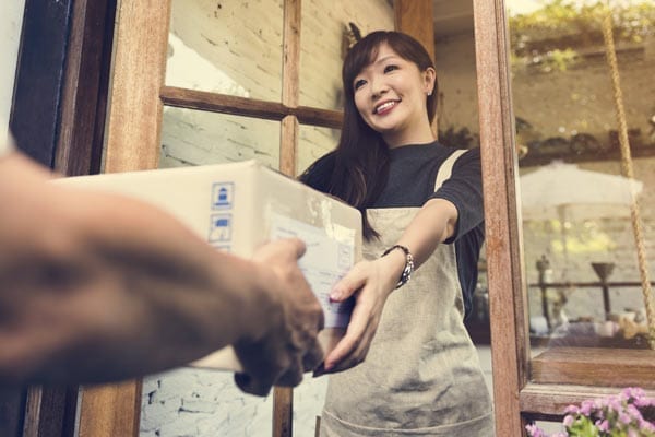 Woman Receiving Package Delivery