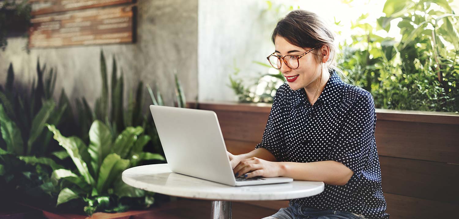 Woman Wearing Glasses Using her Laptop