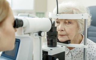 Senior Woman and Eye Doctor Having Eye Exam