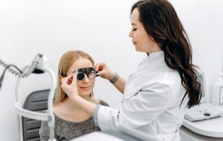 Woman Getting Eye Exam from Eye Doctor
